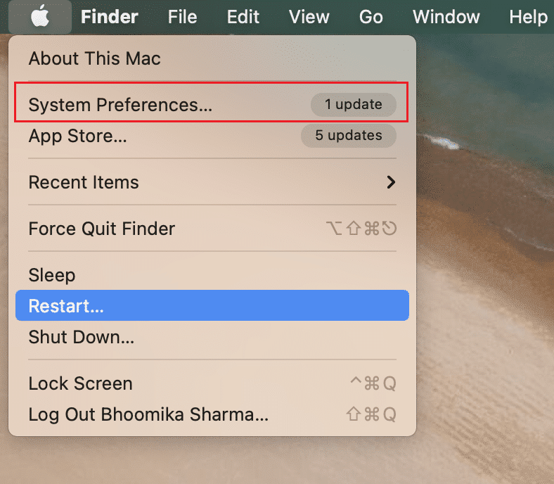 Open System Preferences... in MacBook