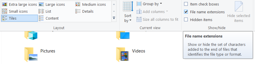 Click on View tab and checkmark File name extensions