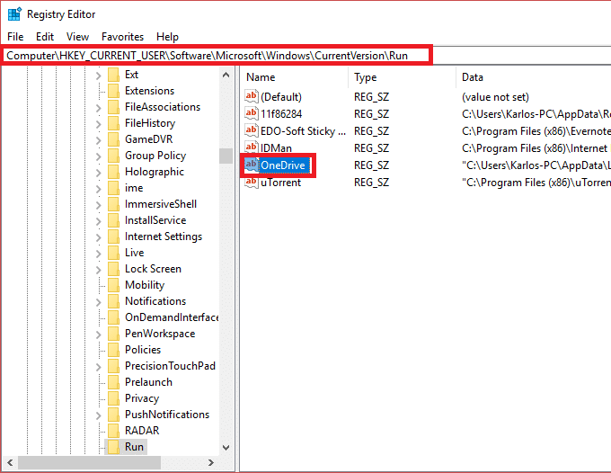 Disable the particular startup program by deleting its registry key