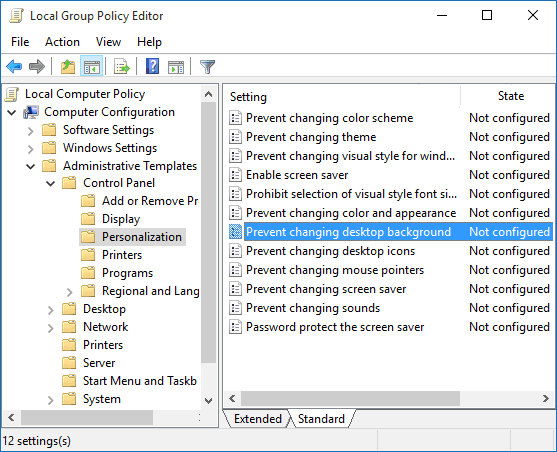 Double-click on Prevent changing desktop background policy