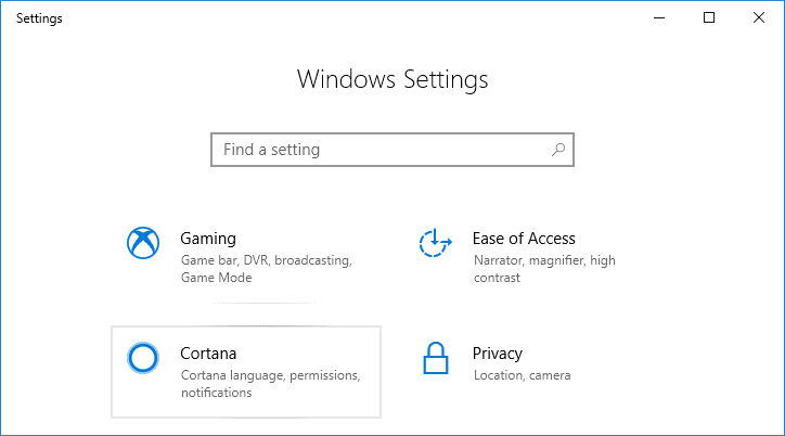 Нажмите клавишу Windows + I, чтобы открыть «Настройки», затем щелкните значок Cortana.