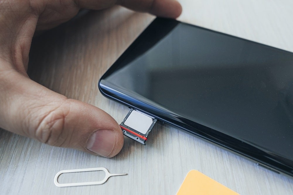 Remove the SIM Card or SD Card from the tray |