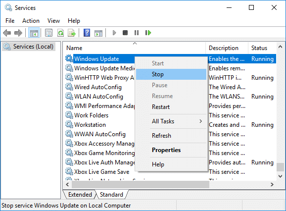 Right-click on Windows Update service and select Stop