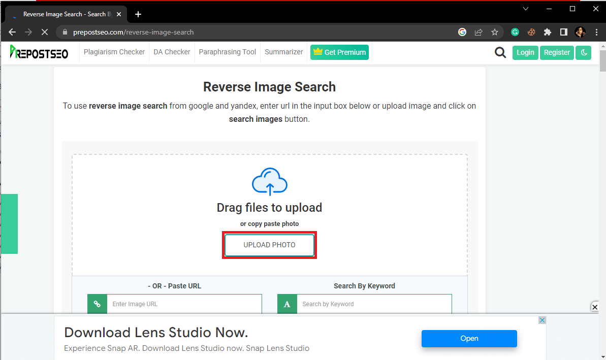 Locate and click on the UPLOAD button to upload the picture you want to reverse search for